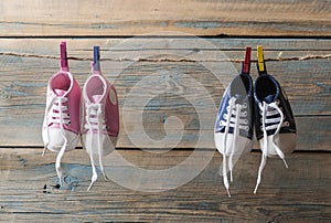 Baby shoes hanging on the clothesline.