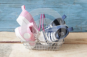 Baby shoes and shopping basket