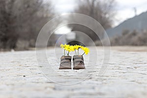 Baby shoes with yellow flowers