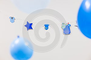 Baby shower background. blue balloons and garland