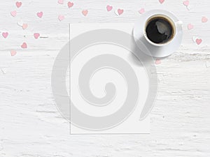 Baby shower, birthday day or wedding mockup scene with blank card, cup of coffee and paper heart confetti. Grunge white