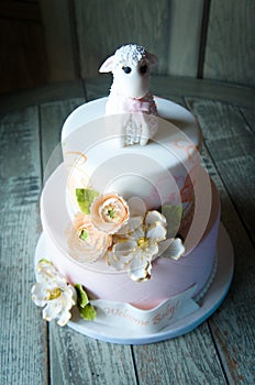 Baby shower cake with lamb and flower topper