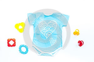 Baby shower concept. Baby`s clothes and accessories on white background top view