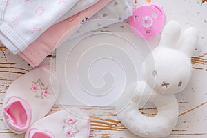 Baby shower concept - child essencials on wood background