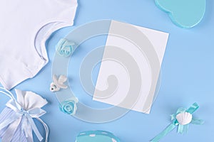 Baby shower invitation 5x7 card mockup with baby boy accessories on blue background