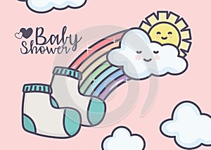 Baby shower socks sun rainbow clouds pink background