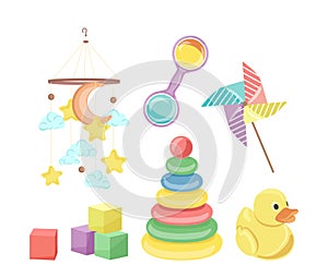 Baby shower toys set with colorful rattles, building blocks, pyramid, rubber duck isolated on white photo