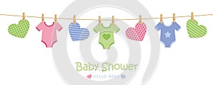 Baby shower welcome greeting card for childbirth with hanging hearts and bodysuits