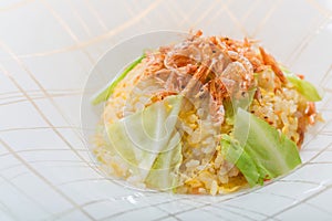 Baby shrimp with fried rice on white plate background