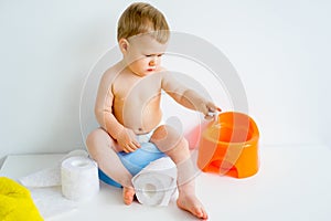 Baby sitting on a potty