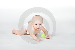 Baby of six month with toy on white background