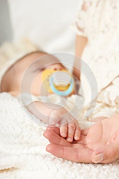 Baby sleep in mother hand, happy maternity concept