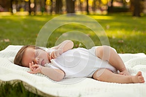 Baby sleeping on the grass