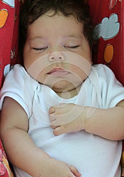 Baby sleeping in a hammock