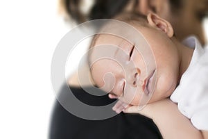 Baby sleeping on mother shoulder. with white background