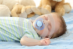 Baby sleeping with a pacifier