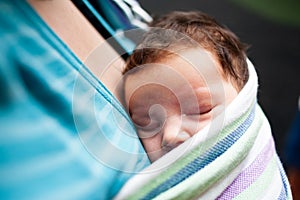 Baby sleeping in sling