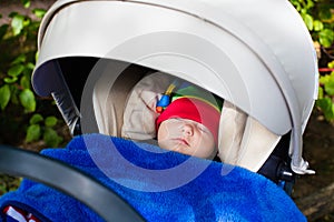 Baby sleeping in a stroller