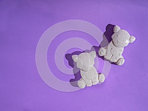 Baby soap in the shape of a tiger on a purple background