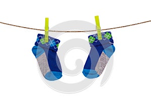 Baby socks hanging on a clothesline