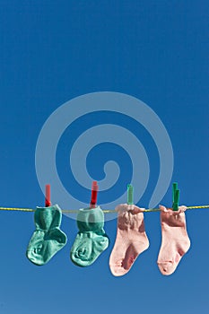 Baby socks on laundry line to dry