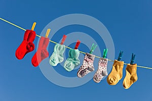 Baby socks on laundry line to dry