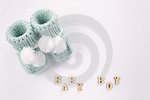 Baby socks on white background. Baby boy birth. Greeting card idea for newborn.Pregnancy announcement. Flatlay, top view