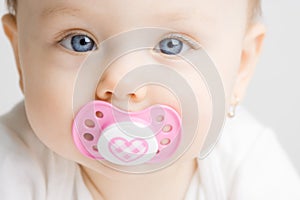 Baby with soother photo
