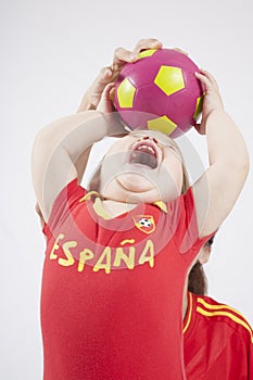Baby spanish team taking ball