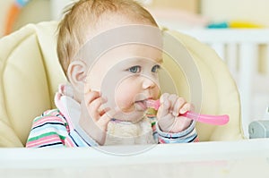 Baby with spoon