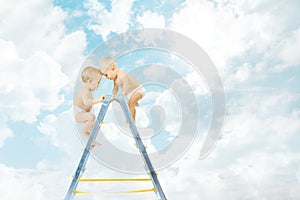 Baby on stepladder fighting for first place over blue sky