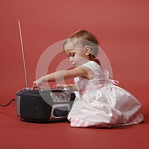 Baby with stereo radio photo