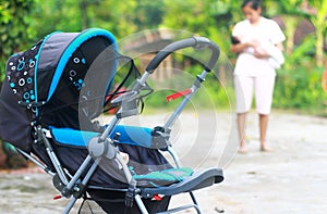 Baby stroller in the park spring day