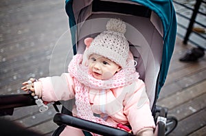 Baby in stroller on a walk in autumn park