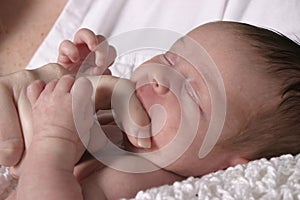 Baby Sucking on Mother's Finger