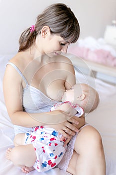 Baby sucks mother`s breast, breast milk feeding newborn baby