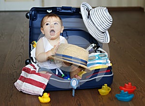 Baby in suitcase ready for travel