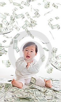 Baby surprised funny face with money rain