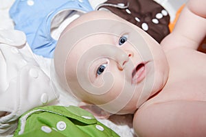 Baby Surrounded by a Rainbow of Cloth Diapers