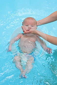 Baby swimming in water