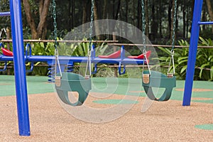 Baby swing set at the playground.