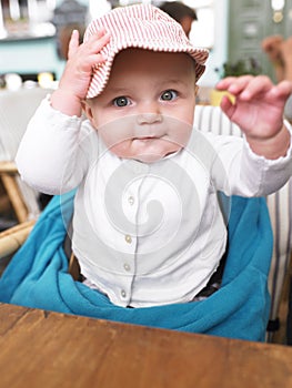 Baby at Table in Restaurant