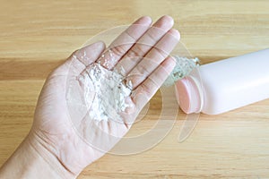 Baby talcum powder on hand photo