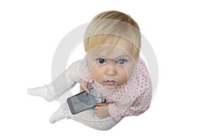 Baby talking by mobile phone isolated on white