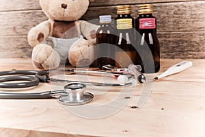 baby teddy bear with stethoscope and medicine