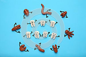 Baby teeth and scary cartoon caries concept. Prevention of oral cavity. Baby dental treatment