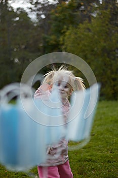 Baby throws out medical masks in nature