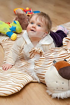 Baby on tiger mat