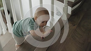 baby toddler boy climbing crawling upstairs home indoors learning climb stairs