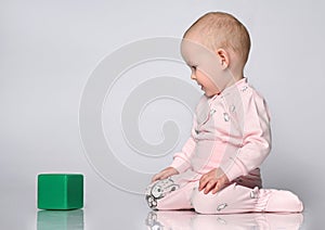 baby toddler playing with building block toys